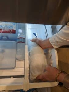 placing the bottle in the freezer