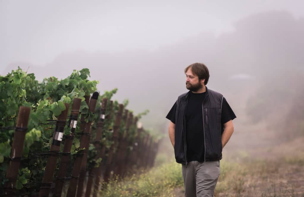 Matt Brady walks through the Rancho la Vina vineyards.