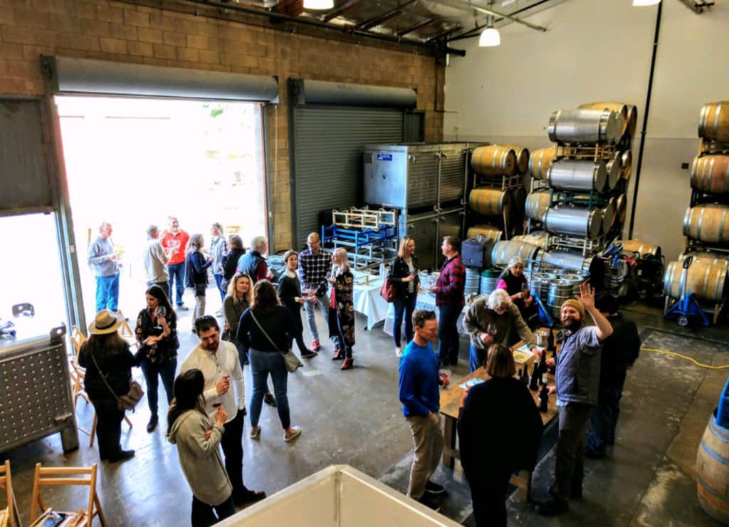 Guests enjoy wine at SAMsARA’s first Winter Pick-Up Party in February 2018 at their new winery.